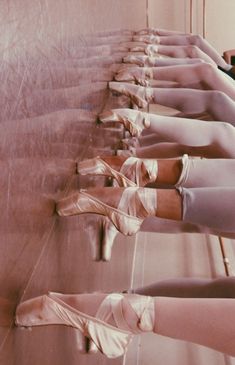 there are many ballet shoes lined up on the floor