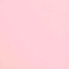 an airplane is flying in the sky on a pink background