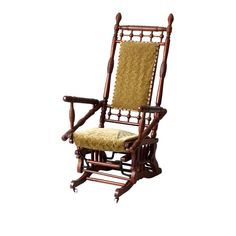 a wooden rocking chair with a cushion on it