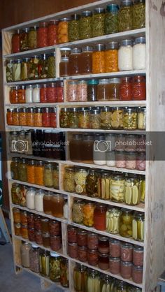 a shelf filled with lots of different types of jars