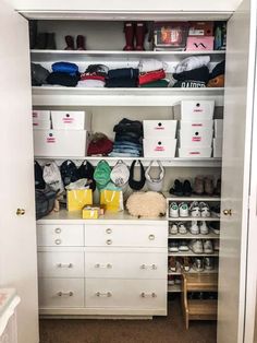 an organized closet with white drawers and lots of items on the shelves, including shoes