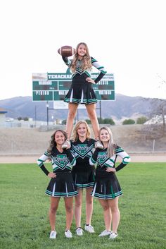 the cheerleaders are posing for a photo