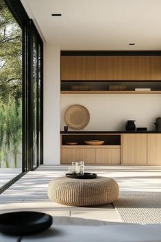 a living room filled with furniture and lots of windows