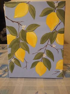 a painting of lemons on a blue background