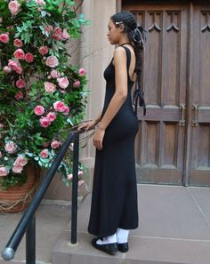 Soft and flowy, curve-hugging and comfortable backless maxi dress in black for when you want to feel maximum dreamy with minimal effort. This dress is named after Flor, the talented seamstress that cut and sewed it. Available in multiple colors. This dress is the REGULAR length, measuring 55 inches from shoulder to hem. We also offer a petite length (50 inches), and a tall length (60 inches). Tall Maxi Dress, Backless Maxi Dress, Backless Maxi Dresses, Multiple Color, Full Skirt, Haiti, Best Sellers, Dress Length, Scoop Neck