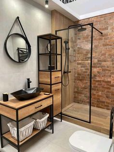 a bathroom with a sink, mirror and shower stall in the middle of the room