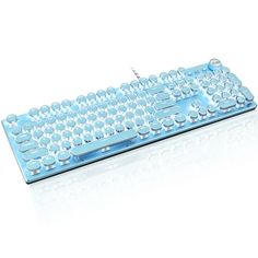 a blue computer keyboard sitting on top of a white surface with water droplets all over it