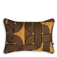 a black and gold pillow with an abstract design