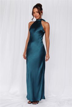 Length from neck to hem of size S: 142cm. 
 Chest: 36cm, Waist: 34cm, across front only of size S. 
 Maxi dress. 
 Lined. 
 Model is a standard XS and is wearing size XS. 
 True to size. 
 Non-stretch. 
 Luxurious satin. 
 Halter tie neckline. 
 High neck. 
 Elastic back. 
 Vent extension. 
 Straight, flowy silhouette. 
 Zipper with hook eye closure.  
 Cold hand wash only. 
 Polyester. 
 This material is very delicate. Please handle with care. 
 Please Note: This product is a Exclusive.  
 
 St Teal Bridesmaid Dresses, Semi Formal Wedding, Teal Wedding, Teal Dress, Satin Maxi, Satin Maxi Dress, Halterneck Dress, Hook Eye, Party Fashion