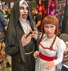 two people in costumes standing next to each other