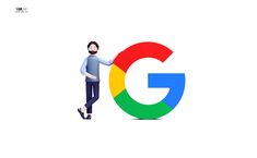 a man standing next to the google logo