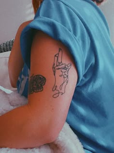 a woman with a tattoo on her arm