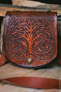 a wooden bag with a tree on it