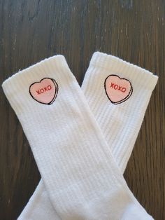 Candy conversation heart is embroidered with the XOXO saying. This is on a plain white  crew sock. UNISEX SIZING. SIZE M(6-10 WOMEN, 8-10 MEN)  SIZE L +  Rep these for valentine's day, or make the perfect gift to pair with some sneakers! Reach out if you have any additional questions. Socks With Hearts, Cute White Socks With Letter Print, Valentine Socks, White Cotton Socks For Gifts, White Cotton Socks As Gift, White Cotton Socks As A Gift, Valentines Socks, Socks Aesthetic, Embroidered Socks