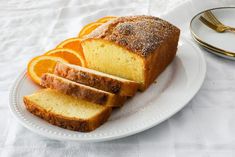 slices of orange pound cake on a white plate