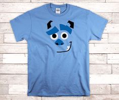 Channel your inner monster with this fun tee! A light blue cotton tshirt has a Sulley from Monsters Inc design cut from top quality HTV. This makes a great costume or theme park outfit! Shirt is available from Toddler to Adult sizes. Currently only available in short sleeves. Theme Park Outfit, Inner Monster, Park Outfit, Theme Park Outfits, Monsters Inc, Cool Tees, Theme Park, Cotton Tshirt, Light Blue