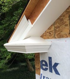 the side of a house that is under construction with wood shingles and siding on it