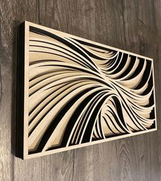 a wooden wall hanging on the side of a wood paneled wall with an intricate design