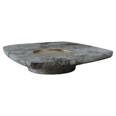 a white marble table with a gold plate in the center on an isolated surface, 3d rendering