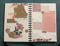 an open notebook with paper and flowers on it