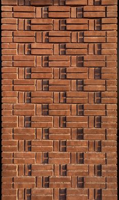 a red brick wall with small squares on it