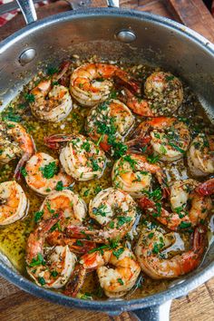 cooked shrimp with garlic and parsley in a pan