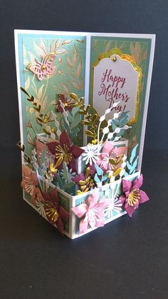 a mothers day card with flowers in a basket