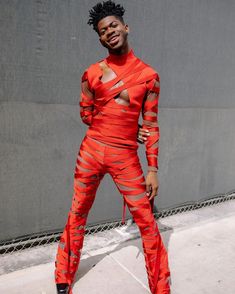 Lil Nas X Concert, Gay Club Outfit, Mode Queer, Outfits Concert, Men Moda, Iconic Looks, Fashion Silhouette, Orange Outfit, Queer Fashion