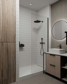 a bathroom with a sink, mirror and shower in it's center area is shown