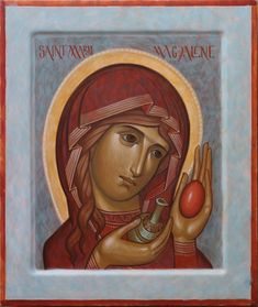 an icon of the virgin mary magdalene holding a small red ball in her right hand