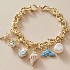 Seashells, Pearls, And Gold Charm Bracelet For Sale! This Charm Bracelet Is New And Is From My Boutique! It Has Beautiful Shell Charms That Are Dangling From A Gold Chain! The Chain Is Made Out Of Stainless Steel. It Is Just Over 7 Inches Long When Unclasped. Such A Great Bracelet To Add To Your Jewelry Collection! Measurements: Bracelet Length: 7.2 Inches Summer Accessories Beach, Link Jewelry, Summer Beach Jewelry, Formal Jewelry, Ocean Fashion, Jewelry Lookbook, Elegant Bracelet, Star Bracelet, Trendy Jewelry