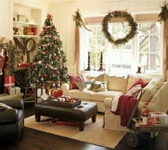 a living room filled with furniture and christmas decorations