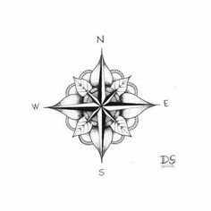 a black and white compass tattoo design