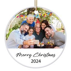 an ornament with a family celebrating christmas