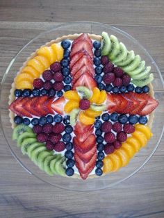 a cake with fruit arranged in the shape of a star