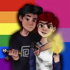 two people standing next to each other in front of a rainbow background