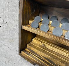 a wooden shelf with some plates on it