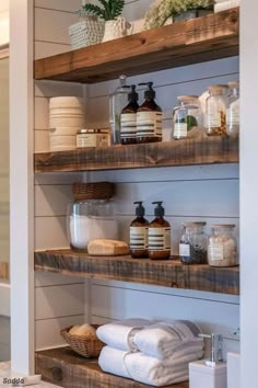 the shelves in this bathroom are made out of wood