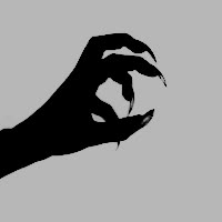 a hand holding something in the air with it's fingers extended up to show its shadow