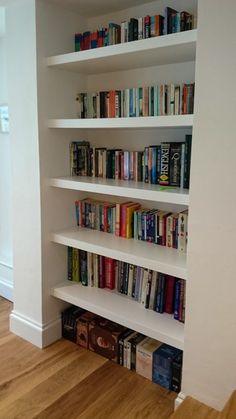 the bookshelf is filled with many different types of books on it's shelves