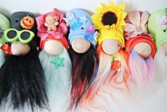 there are many different types of stuffed animals in the same row, each with long black hair and sunflowers on their heads