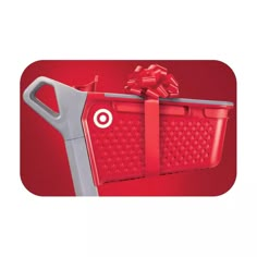 a red shopping basket with a bow on it