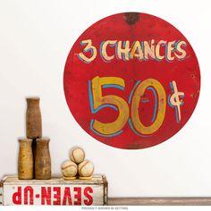 a red sign that says 3 changes at 50 and has some baseballs on it