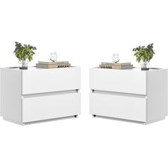 two white nightstands with plants on top