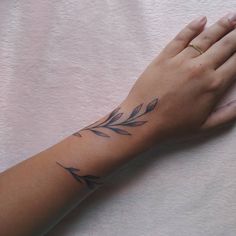 a woman's arm with a tattoo on it