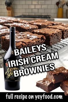 a bottle of bailey's irish cream brownies next to chocolate brownies on a cooling rack