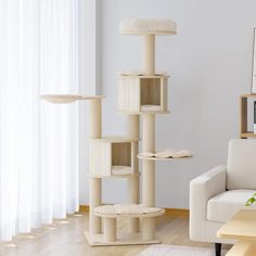 a cat tree in the middle of a living room next to a couch and table