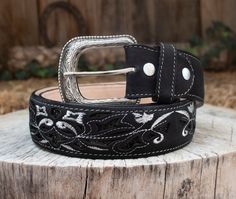 -Silver etched buckle -Floral embroidery  -Genuine leather Western Black Embroidered Belt, Black Western Style Embroidered Belt, Western Silver Embroidered Belt, Leather Belts Western, Duncan The Tall, Cowgirl Belt, Belts Western, Cowgirl Belts, Hand Of The King