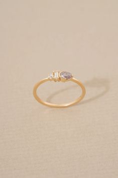 a gold ring with two stones on it