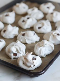 there are many small pastries on the baking sheet